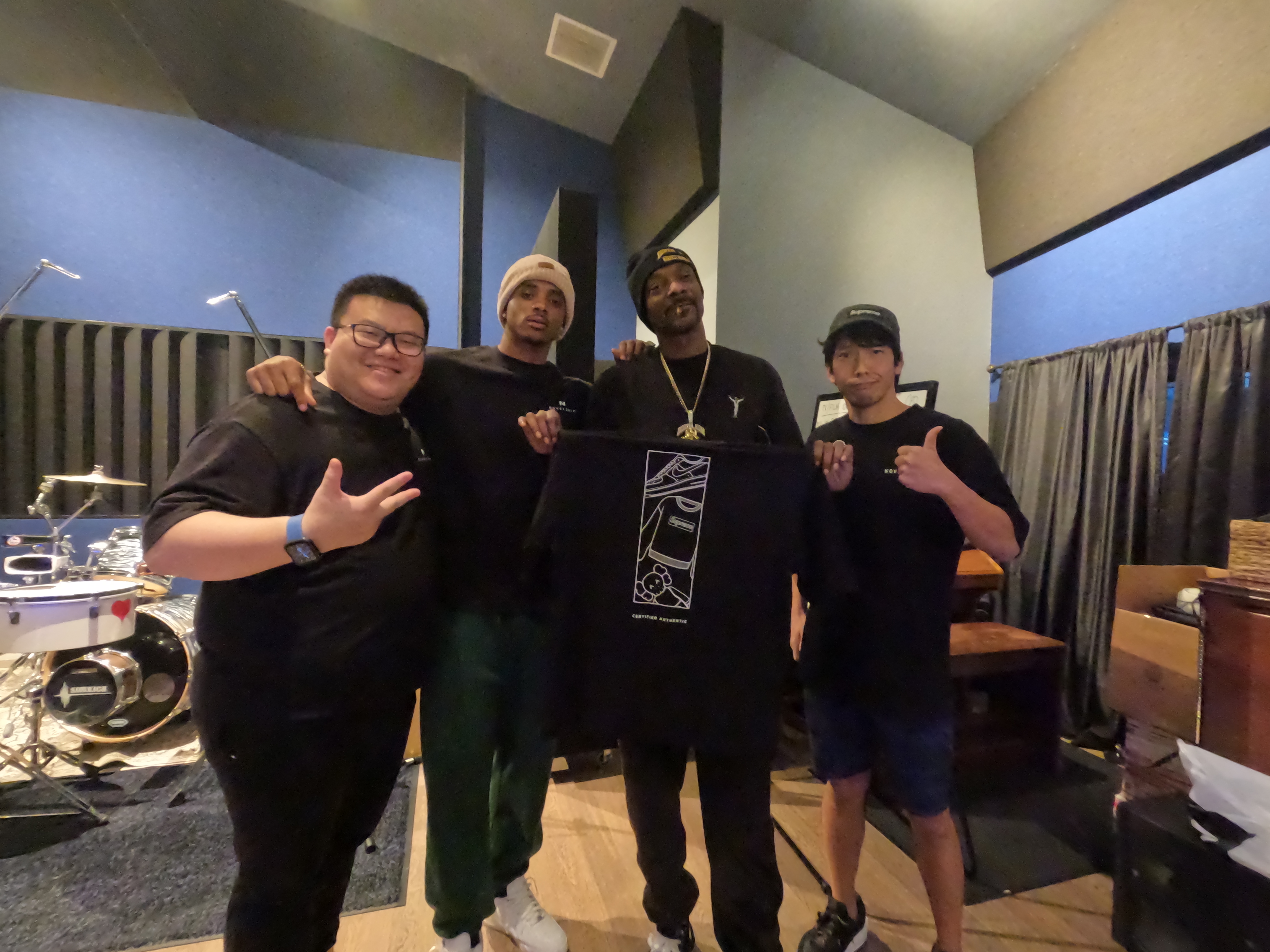 Snoop Dogg and his son Cordell with Richard Xia (left) and Kenji Narushima (right)